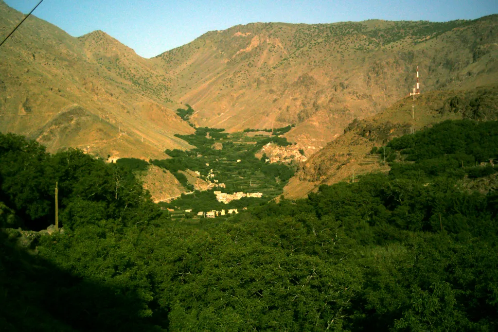 The village of Imlil in a green valley beneath the arid slopes of the High Atlas Mountains, Morocco