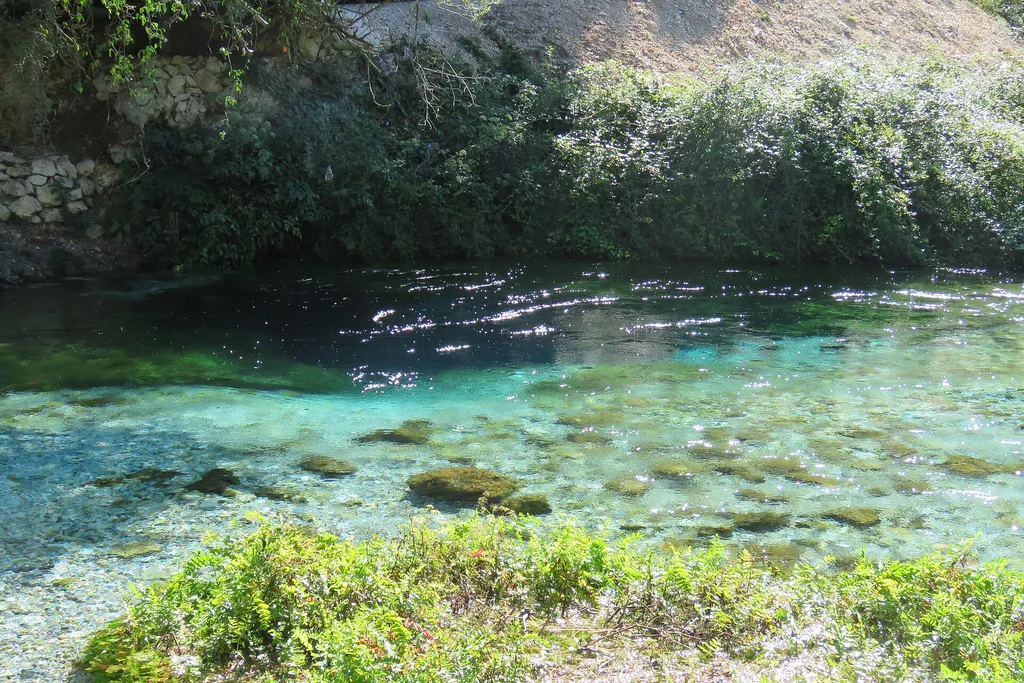 The Blue Eye spring near Sarande in southern Albania, turquoise water under green trees
