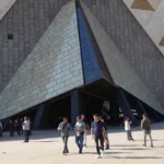 Grand Egyptian Museum at El Remayah Square in Giza, with the Pyramids of Giza on the horizon