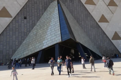 Grand Egyptian Museum at El Remayah Square in Giza, with the Pyramids of Giza on the horizon