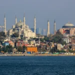 The Blue Mosque and Hagia Sophia on the Sultanahmet skyline, seen across the Bosphorus in Istanbul, Türkiye