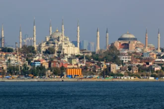 The Blue Mosque and Hagia Sophia on the Sultanahmet skyline, seen across the Bosphorus in Istanbul, Türkiye