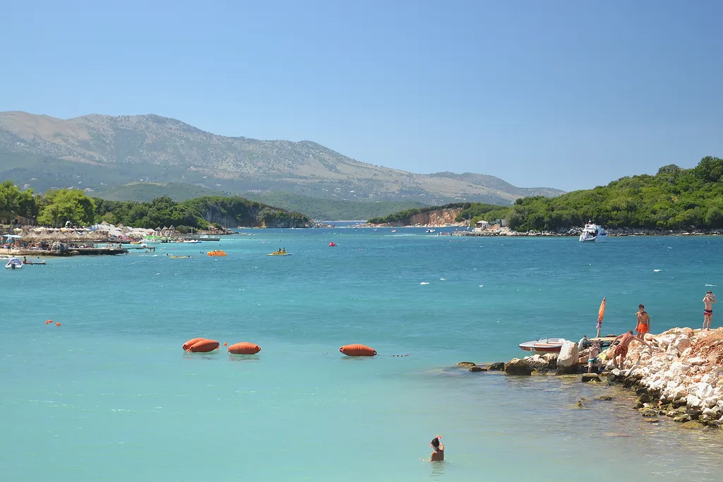 Swimmers in the turquoise bay at Ksamil, southern Albania