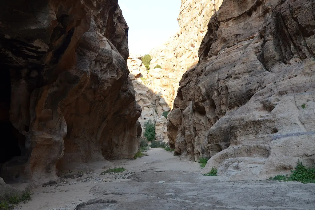 A carved facade in the narrow gorge of Little Petra (Siq al-Barid)