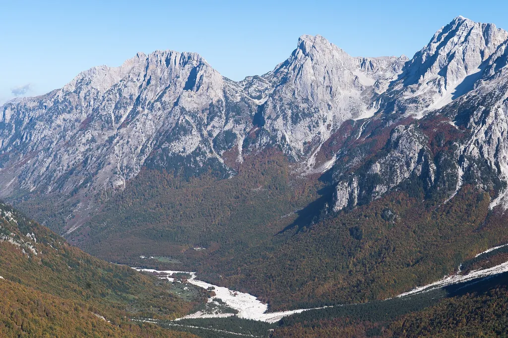 The Valbona valley in the Albanian Alps, a river plain under high limestone peaks